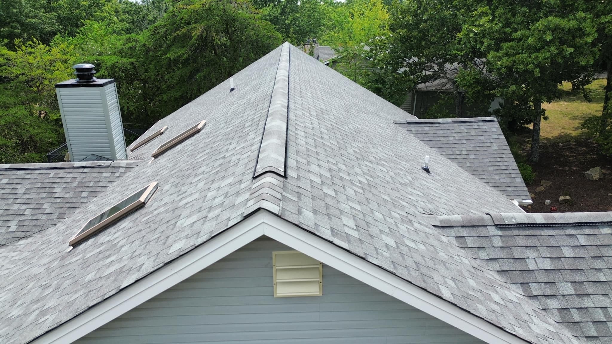 Completed shingle roof with ridge cap detail