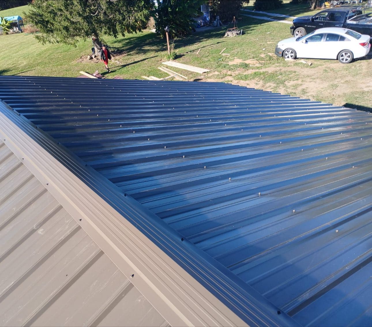 New metal roofing installation on residential building