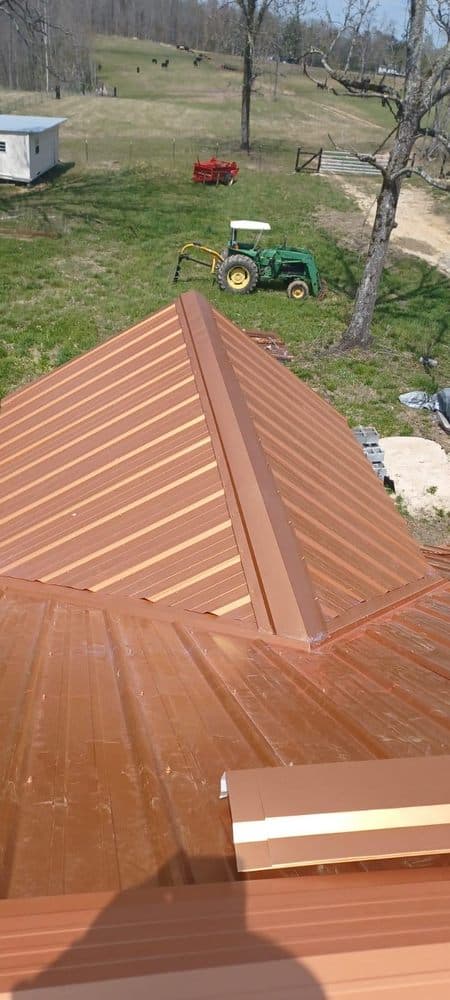 Copper-colored metal roof on rural home
